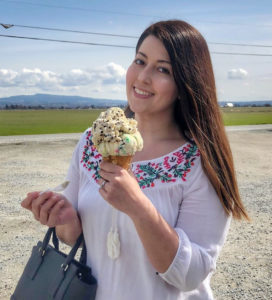 women smiling with big ice cream cone
