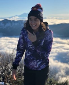 woman laughing mountain winter clothing