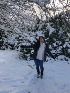 woman happy arns out snow